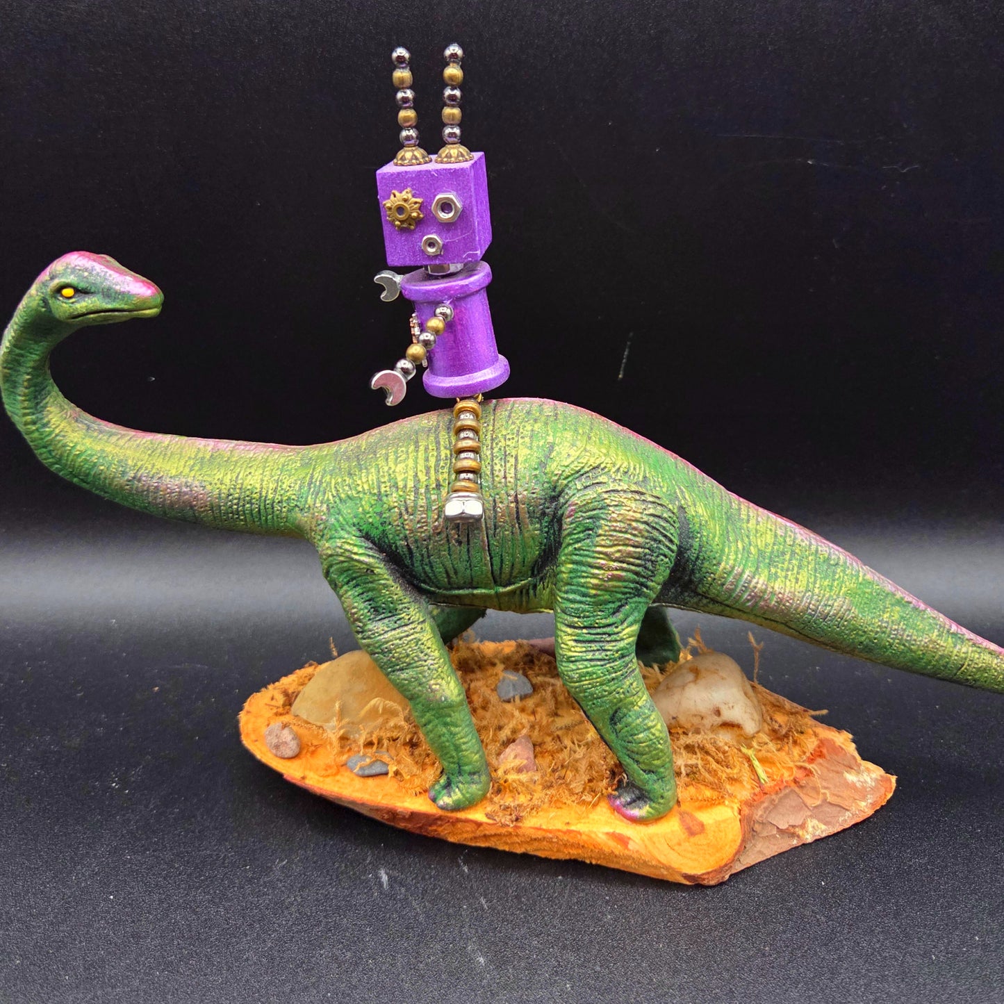 Hand-Made Robot Riding on a Dinosaur