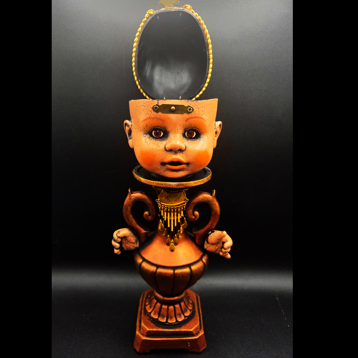 Baby Head Box on a Vase-Shaped Stand