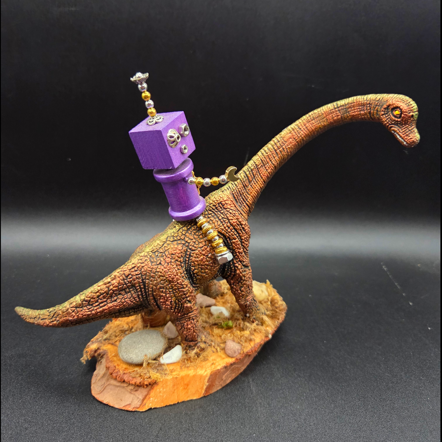 Hand-Crafted Robot on a Dinosaur
