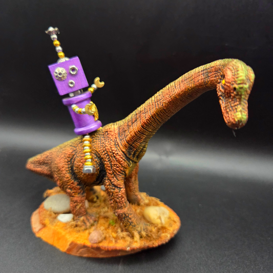 Hand-Crafted Robot on a Dinosaur